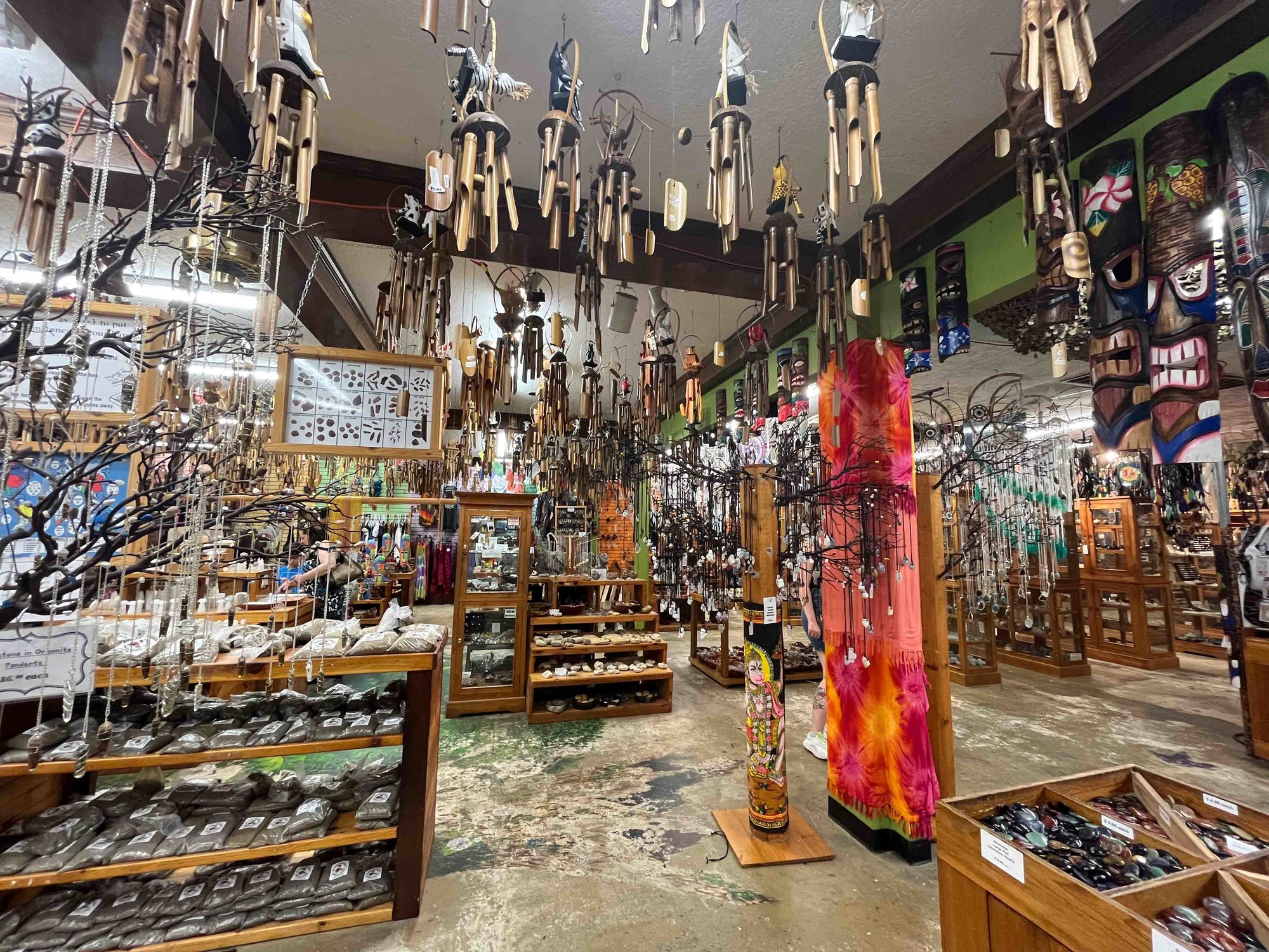 large store filled with wooden wind chimes and various mineral goods